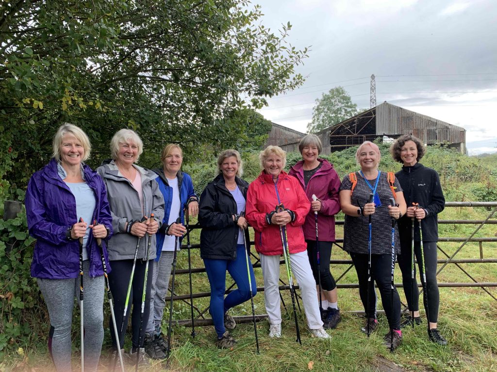 Group of smiling nordic walkers